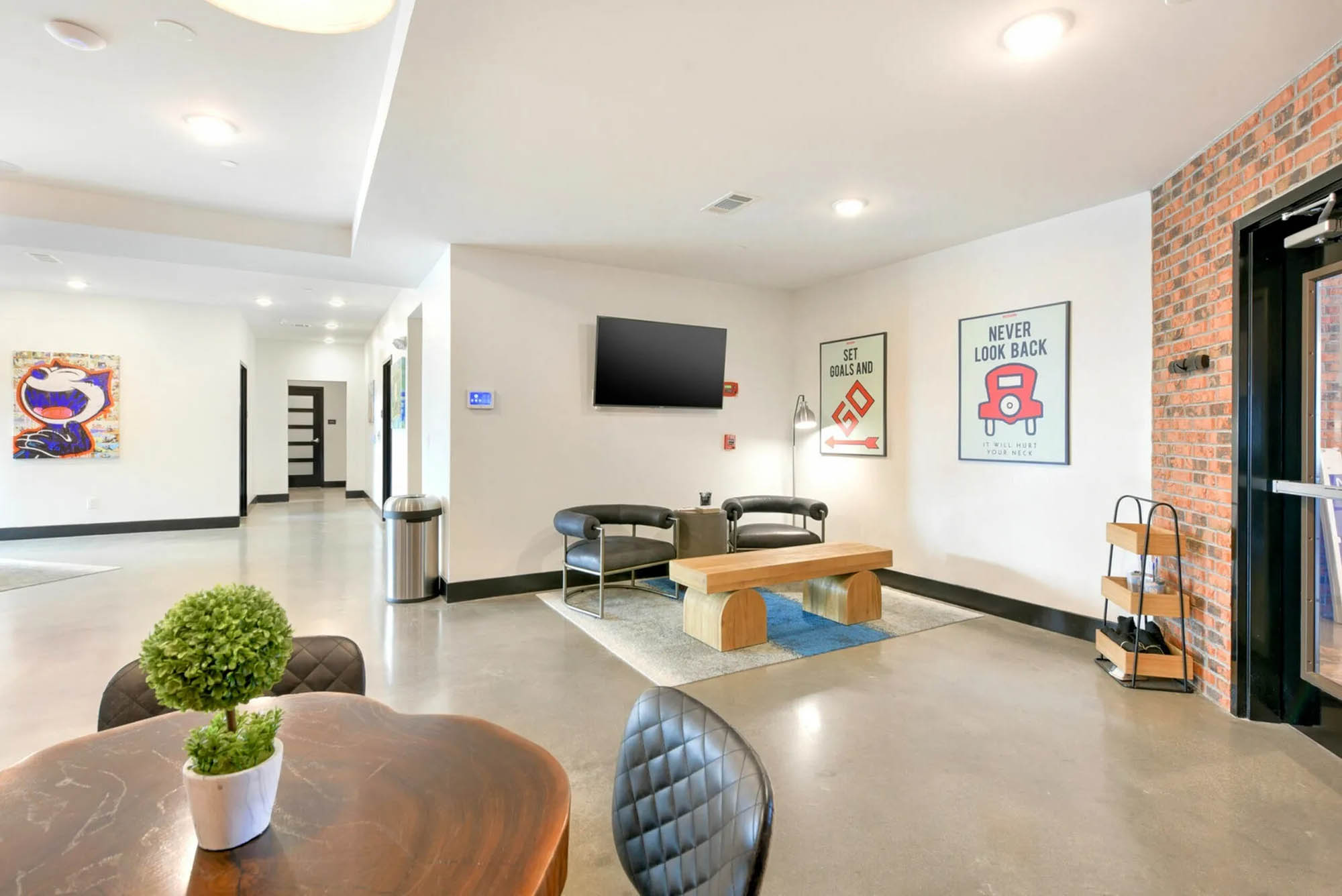 Bright and open common space with modern chairs and pop art