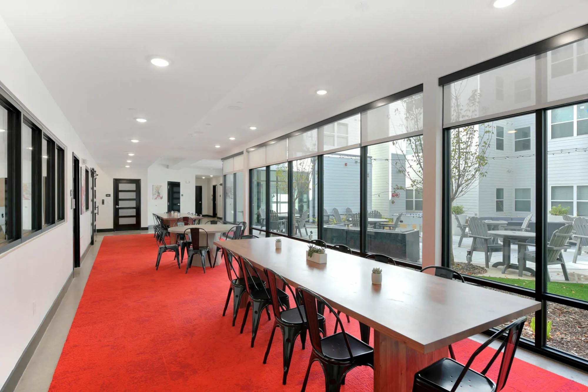 Communal tables with view of courtyard
