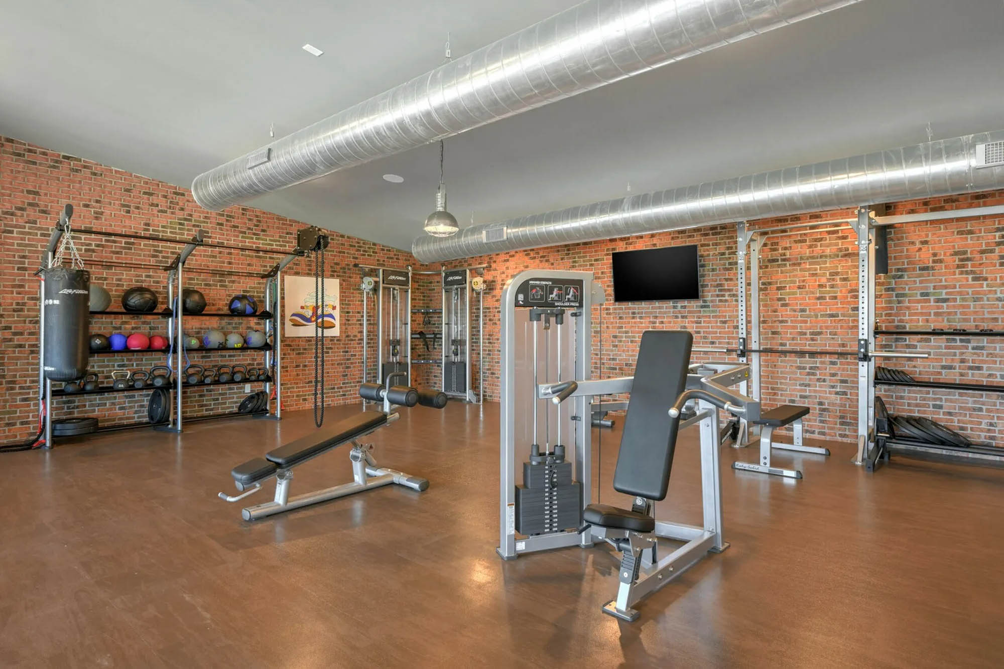 Fitness center with industrial brick wall finish